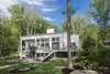Modern home with Outdoor, Back Yard, Trees, Walkways, Wood Patio, Porch, Deck, Retaining Fences, Wall, Wood Fences, Wall, Metal Patio, Porch, Deck, Wire Fences, Wall, and Decking Patio, Porch, Deck. View from lake Photo 2 of Khabensky Residence