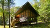 Modern home with Exterior, House Building Type, Wood Siding Material, Metal Roof Material, and Shed RoofLine. View from forest Photo 5 of Dickerman Residence