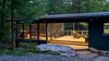 Modern home with Exterior, Wood Siding Material, Metal Roof Material, Shed RoofLine, and House Building Type. View of entry in evening Photo 6 of Dickerman Residence