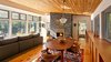 Modern home with Living Room, Sectional, Wood Burning Fireplace, Pendant Lighting, and Medium Hardwood Floor. View of living room Photo 8 of Dickerman Residence
