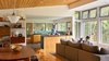Modern home with Kitchen, Stone Counter, Wood Cabinet, Ceramic Tile Backsplashe, Medium Hardwood Floor, Undermount Sink, and Pendant Lighting. View of kitchen Photo 9 of Dickerman Residence