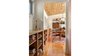 Modern home with Table, Pendant Lighting, and Medium Hardwood Floor. View of hallway Photo 11 of Dickerman Residence