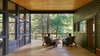 Modern home with Exterior, Metal Roof Material, Wood Siding Material, Shed RoofLine, and House Building Type. View of forest through entry Photo 13 of Dickerman Residence