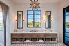 Modern home with Bath Room, Marble Counter, Marble Floor, Undermount Sink, Freestanding Tub, Open Shower, Ceiling Lighting, Accent Lighting, Marble Wall, and One Piece Toilet. 155 Bannerman Beach Lane :: Master Bath Photo 5 of 155 Bannerman Beach Lane