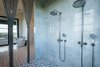 Modern home with Bath Room, Marble Counter, Marble Floor, Undermount Sink, Freestanding Tub, Open Shower, Recessed Lighting, Ceiling Lighting, Accent Lighting, and One Piece Toilet. 155 Bannerman Beach Lane :: Master Bath Photo 16 of 155 Bannerman Beach Lane