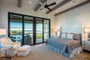 Modern home with Bedroom, Bed, Dresser, Night Stands, Chair, Lamps, Recessed Lighting, Table Lighting, and Medium Hardwood Floor. 155 Bannerman Beach Lane :: Master Bedroom Photo 19 of 155 Bannerman Beach Lane