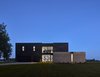 Modern home with Exterior, House Building Type, Concrete Siding Material, and Wood Siding Material. Nighttime view looking south from the street. (2017) Photo of 530 house