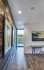 Modern home with Bedroom, Bed, Chair, Recessed Lighting, and Dark Hardwood Floor. View to the Missouri River from the master bedroom. The formerly-exterior, cedar sheathed wall is shown at the left. (2017) Photo 8 of 530 house