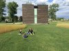 Modern home with Exterior, Wood Siding Material, and House Building Type. Lisa and the boys playing Ring Around the Rosie. (2016, before the guest suite addition) Photo 17 of 530 house