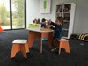 Modern home with Kids Room, Playroom Room Type, Bookcase, Storage, Shelves, Chair, Toddler Age, and Boy Gender. The family room (Oliver and Logans loft, 2017) Photo 19 of 530 house