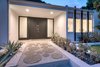 Modern home with Outdoor, Front Yard, and Hardscapes. Front door at night Photo 4 of Benton Park, AIA Mid Century Modern