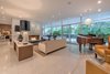 Modern home with Living Room, Bench, Chair, Sofa, Sectional, Recliner, Ottomans, End Tables, Coffee Tables, Bookcase, Ceiling Lighting, Floor Lighting, Table Lighting, Console Tables, Wall Lighting, Recessed Lighting, Accent Lighting, Terrazzo Floor, Two-Sided Fireplace, and Gas Burning Fireplace. Living room with high ceilings Photo 5 of Benton Park, AIA Mid Century Modern