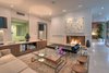 Modern home with Living Room, Bench, Chair, Sofa, Ottomans, Coffee Tables, Ceiling Lighting, Gas Burning Fireplace, Recessed Lighting, Wall Lighting, Terrazzo Floor, and Two-Sided Fireplace. Beautiful living room with restored terrazzo flooring Photo 7 of Benton Park, AIA Mid Century Modern