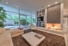 Modern home with Living Room, Sectional, Recliner, Ceiling Lighting, Terrazzo Floor, Two-Sided Fireplace, Gas Burning Fireplace, and Recessed Lighting. Custom tiled fireplace Photo 8 of Benton Park, AIA Mid Century Modern