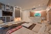 Modern home with Living Room, Sectional, Recliner, Ceiling Lighting, Recessed Lighting, Terrazzo Floor, and Two-Sided Fireplace. Family room with bar - fantastic entertaining Photo 9 of Benton Park, AIA Mid Century Modern