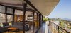 Modern home with Living Room, Sofa, Pendant Lighting, Concrete Floor, Ottomans, and Floor Lighting. Living Pavilion Photo 4 of Crossing Wall House