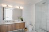 Modern home with Bath Room, Marble Counter, Porcelain Tile Floor, Undermount Sink, Open Shower, Full Shower, Ceiling Lighting, Wall Lighting, One Piece Toilet, Recessed Lighting, Accent Lighting, and Marble Wall. Master Bathroom Photo 2 of Pierhouse At Brooklyn Bridge Park Condo