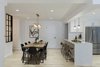 Modern home with Dining Room, Pendant Lighting, Chair, Accent Lighting, Table, Bar, Recessed Lighting, Stools, Shelves, Medium Hardwood Floor, Ceiling Lighting, and Light Hardwood Floor. Dining Room & Kitchen Photo 3 of Upper East Side Oasis