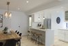 Modern home with Kitchen, Light Hardwood Floor, Ceiling Lighting, Subway Tile Backsplashe, Medium Hardwood Floor, Pendant Lighting, Refrigerator, Recessed Lighting, White Cabinet, Accent Lighting, Engineered Quartz Counter, Quartzite Counter, Undermount Sink, and Marble Counter. Dining Room & Kitchen Photo 5 of Upper East Side Oasis