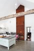 Modern home with Kitchen, Concrete Counter, Open Cabinet, Range, Pendant Lighting, Concrete Floor, and Vessel Sink. Givone considers his pizza-cooking technique in front of the custom built wood-fired oven. Photo of The Floating Farmhouse