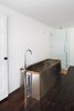 Modern home with Bath Room, Recessed Lighting, Corner Shower, Dark Hardwood Floor, Enclosed Shower, and Soaking Tub. A salvaged 19th-century soaking tub wrapped in stainless steel is topped by Hudson Reed faucets. Photo 3 of The Floating Farmhouse