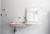 Modern home with Bath Room, Marble Counter, and Wall Mount Sink. In the guest bathroom, Givone installed a hand-chiseled sink made of 17th-century marble quarried from the hills outside of Rome. Photo 8 of The Floating Farmhouse