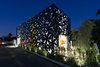 Modern home with Exterior, House Building Type, Green Roof Material, and Metal Siding Material. 4016 Tivoli at night Photo of 4016 Tivoli