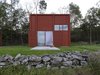 Modern home with Exterior, House Building Type, and Wood Siding Material. The opening of the facade to the ground level is 3.5 meters high and is provided with magazine doors for sun and wind protection. Photo 2 of Späckhuggaren