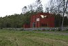 Modern home with Exterior, House Building Type, and Wood Siding Material. The location of the building between the fields and forest. The torque of the interior in the upward motion is reflected in the facade expression. Photo 3 of Späckhuggaren