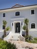 Modern home with Exterior, Tile Roof Material, A-Frame RoofLine, House Building Type, and Stucco Siding Material. Ocean Reef by Armina Interiors Photo 7 of Ocean Reef