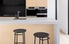 Modern home with Kitchen, Concrete Counter, Glass Tile Backsplashe, Wall Oven, Laminate Cabinet, Wood Cabinet, Light Hardwood Floor, Microwave, Cooktops, and Undermount Sink. Coming soon Photo of Eaglemont Residence