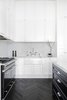 Modern home with Kitchen, Stone Slab Backsplashe, Stone Counter, Dark Hardwood Floor, White Cabinet, Cooktops, Drop In Sink, Marble Backsplashe, Marble Counter, Wall Oven, and Range. Modern Parisian-style kitchen Photo 6 of Prahran Residence