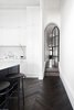 Modern home with Hallway and Dark Hardwood Floor. The steel arched doorways into the communal zones Photo 7 of Prahran Residence