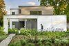 Modern home with Exterior, Flat RoofLine, House Building Type, Stucco Siding Material, and Wood Siding Material. Street Elevation Photo of The Gregory House