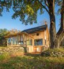 Modern home with Exterior, Shingles Roof Material, House Building Type, Gable RoofLine, and Wood Siding Material. New Sunporch added. Photo 3 of Vermont Barn to High Performance Home