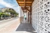 Explore implications: Architectural object as molding and adaptation of its environment.
The housing units are designed to correspond the climatic conditions of the area; this
includes the circulation of natural air and the penetration of natural light, reinterpreting the
traditional architecture of the area, highlighting its main elements.
The opening of its single façade, fragmented by an exterior gallery, facing a wide street,
allows us to incorporate the natural and built environment to the houses. To this end, it was
worked to be used as a buffer zone that promotes, under safety regulations, the relationship
between the interior and the exterior with the main street of the city.
It was created then, in its single facade, a dynamic and permeable, which promotes the entry
of wind and light into its interior spaces; through an ornamental wall with traditional blocks on
the ground floor, which works as a barrier and separates the interior with the exterior gallery,
and re-interprets a new architectural form. And with the intention of promoting lightness, in
the upper floor we worked with polycarbonate, a lightweight, non-sharp plastic material,
divided into modulated panels. Photo 5 of The Lighhouse: Vernacular architecture that respects the traditional logics with lines of contemporaneity. modern home