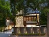 Modern home with Exterior, House Building Type, Wood Siding Material, Metal Roof Material, Stone Siding Material, Glass Siding Material, Metal Siding Material, and Stucco Siding Material. Front Elevation Photo of RSA Residence