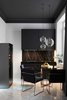 Modern home with Kitchen, Colorful Cabinet, Refrigerator, Marble Backsplashe, Marble Floor, Range Hood, Pendant Lighting, Marble Counter, and Drop In Sink. Geometrium's design expertise lies in the apartment sphere, and the Stalinskaya building is no exception—this compact yet stylish kitchen packs a serious punch. Photo 3 of Stalinskaya Building