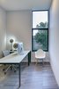 Modern home with Office, Study Room Type, Chair, Lamps, Porcelain Tile Floor, and Desk. A small office separates the master bedroom from the kitchen. Photo 9 of 328 Koser