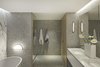 Modern home with Bath Room, Engineered Quartz Counter, Marble Floor, Freestanding Tub, Open Shower, Accent Lighting, Wall Lighting, Mosaic Tile Wall, and Drop In Sink. Bathrooms are finished with marbles slabs, marble penny tile and pickled white oak. Photo 9 of Whiteline Residence