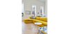 Modern home with Living Room, End Tables, Sectional, Bookcase, Ottomans, Ceiling Lighting, Recessed Lighting, and Light Hardwood Floor. Media Room/ Library/ Guest Suite Photo 4 of Courtyard House