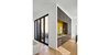 Modern home with Hallway and Light Hardwood Floor. Entry/ Bar & Courtyard Photo of Courtyard House