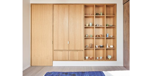 Guest bedroom rift & quartered oak closet, display shelving and door to storage.  