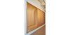 Modern home with Light Hardwood Floor, Storage Room, Cabinet Storage Type, Closet Storage Type, and Shelves Storage Type. Entry rift & quartered oak millwork storage, closet & bench. Photo 10 of West Loop Residence