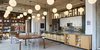 Modern home with Dining Room, Chair, Table, Desk, Shelves, Storage, Accent Lighting, Pendant Lighting, and Light Hardwood Floor. Kitchen with new stone counter and full-height backsplash and rift & quartered oak millwork. Photo 3 of West Loop Residence