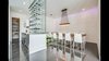 Modern home with Dining Room, Table, Chair, Ceiling Lighting, Table Lighting, Accent Lighting, Ceramic Tile Floor, and Wall Lighting. Dining room with a texture wall. Photo 2 of The Peña Home