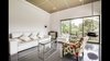 Modern home with Living Room, Sectional, Sofa, Chair, Ceiling Lighting, Ceramic Tile Floor, Hanging Fireplace, and Gas Burning Fireplace. Living room Photo 3 of The Peña Home