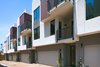 Modern home with Attached Garage Room Type, House Building Type, Stucco Siding Material, Metal Siding Material, Small Patio, Porch, Deck, Metal Fences, Wall, Doors, Swing Door Type, and Exterior. Upper-level decks are deeply stepped back, respecting the scale of the existing neighborhood. Photo 3 of COVO