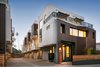 Modern home with House Building Type, Stucco Siding Material, Metal Siding Material, Shrubs, Metal Fences, Wall, Small Patio, Porch, Deck, Attached Garage Room Type, Doors, Swing Door Type, and Exterior. Folding metal planes and angular details help to create visual interest at the pedestrian level. Photo 11 of COVO
