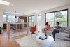 Modern home with Light Hardwood Floor, Laminate Cabinet, Pendant Lighting, Recessed Lighting, Refrigerator, Chair, Sofa, Wood Railing, Wood Tread, Doors, Cable Railing, Sliding Door Type, and Interior. Third-floor living continues onto expansive outdoor rooms, blurring lines between indoor and outdoor. Photo 7 of COVO